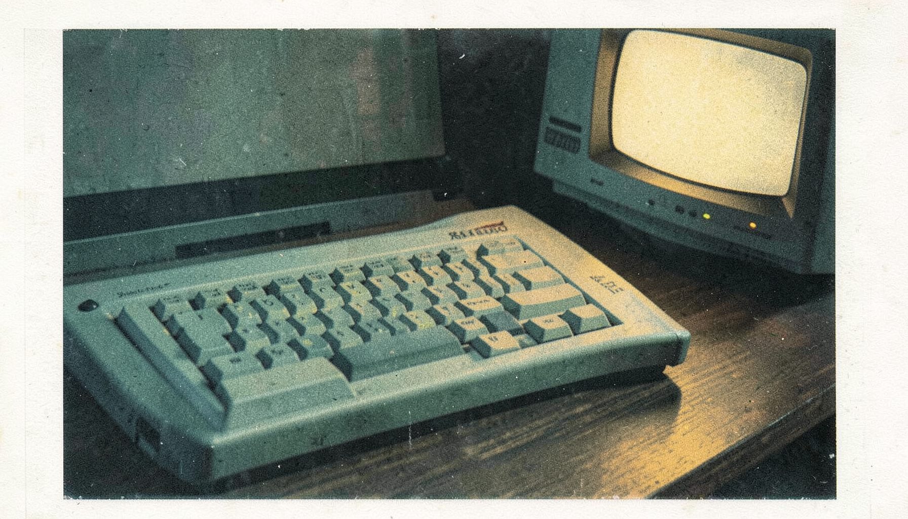 A two-ink risograph print in muted teal and warm ochre: a close-up of a Sharp X68000 computer keyboard with its distinctive layout, resting on a dark wooden desk beside a CRT monitor glow, soft shadows pooling around the keys.